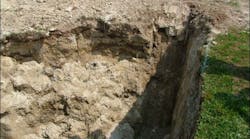 Photo 1: The parts of the trench include the wall, the lip, the belly, the toe, and the floor. This trench suffered a partial side wall shear near one end.
