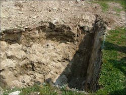 Photo 1: The parts of the trench include the wall, the lip, the belly, the toe, and the floor. This trench suffered a partial side wall shear near one end.