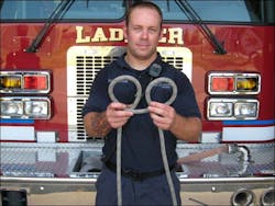 Photo 6B: Form two loops as you would if you were making a Clove Hitch. Photo 6B: Form two loops as you would if you were making a Clove Hitch.