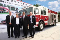 For the first time in China, a Pierce fire truck was displayed at the China Fire Show in Beijing in October 2009. The display highlighted the sale of six Saber&circledR; pumpers in the country. Pictured (left to right) Tom Bocik, Oshkosh Corporation; Director General Niu Yue Guang, Chief of Jiangsu Province Fire Department; Wilson Jones, Oshkosh Corporation and Desmond Soh, Oshkosh Corporation.