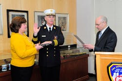 Fire Commissioner Salvatore Cassano administers the Oath of Office to Edward Kilduff, who was sworn in as the FDNY&apos;s 34th Chief of Department with his wife, Kathy, at his side.