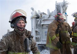 Firefighters and their engine are covered with ice as they battle a fire at a bowling alley in the Omaha, Neb., suburb of Elkhorn on Jan. 7. Firefighters and their engine are covered with ice as they battle a fire at a bowling alley in the Omaha, Neb., suburb of Elkhorn on Jan. 7.