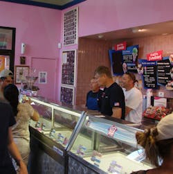 Firefighters Bryan Ferguson, Chip Decker, and Tom Queen scooped ice cream last year at the Bullhead City, Ariz. Baskin Robbins.