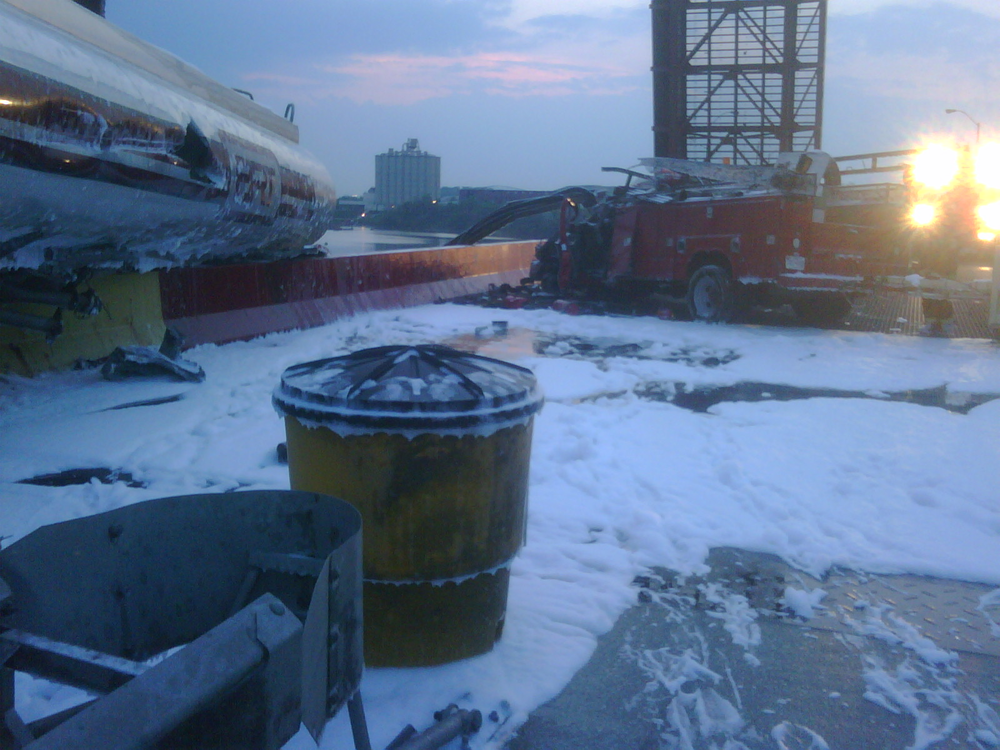 A tanker truck overturned Friday morning in Curtis Bay, a crash that left a rear portion of the truck dangling over the side of the bridge.