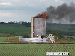 A 20,000 gallon tank containing crude oil burns after being struck by lightning on June 8.