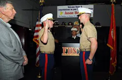 Firefighter Jason Brezler, right, takes the Oath of Office, promoting him to Major in the U.S. Marine Corps. Firefighter Jason Brezler, right, takes the Oath of Office, promoting him to Major in the U.S. Marine Corps.