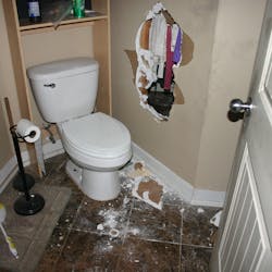 The homeowner began kicking his way through the drywall into another room and when he tried to exit through the hole, he became stuck. The homeowner began kicking his way through the drywall into another room and when he tried to exit through the hole, he became stuck.