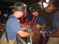 Captain Michael Conlin and members of Rescue 1 set up the equipment needed for the operation. Captain Michael Conlin and members of Rescue 1 set up the equipment needed for the operation.