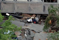 Rescue officials use electronic equipment to check for missing people. Rescue officials use electronic equipment to check for missing people.