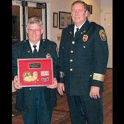 Chief Posey Dillon, right, with Firefighter Danny Altice in February 2008 when Altice was presented a lifetime achievement award.