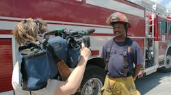 Captain Fredrick Blake with Quint 13 was asked to talk with a TV reporter about what it was like to fight a large, warehouse fire fanned by high winds.
