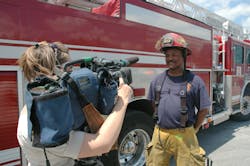 Captain Fredrick Blake with Quint 13 was asked to talk with a TV reporter about what it was like to fight a large, warehouse fire fanned by high winds. Captain Fredrick Blake with Quint 13 was asked to talk with a TV reporter about what it was like to fight a large, warehouse fire fanned by high winds.