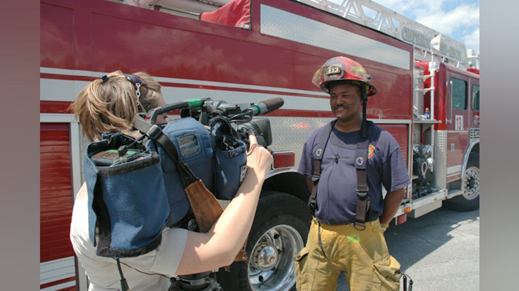 Captain Fredrick Blake with Quint 13 was asked to talk with a TV reporter about what it was like to fight a large, warehouse fire fanned by high winds.