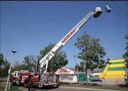 Crews use Ladder 8's aerial ladder and bucket to access a simulated 'stranded cabin' along the Skyride route. Crews use Ladder 8's aerial ladder and bucket to access a simulated 'stranded cabin' along the Skyride route.