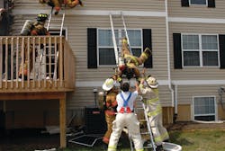 Two firefighters had to ladder bail after their escape down the stairwell was cut off by flames. Two firefighters had to ladder bail after their escape down the stairwell was cut off by flames.