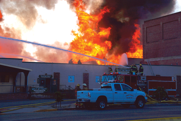 Heat from the fire pushed firefighters off the manned hoselines above the mini-storage building west of the fire. Thermal imagers were used by crews monitoring conditions inside adjacent exposures.