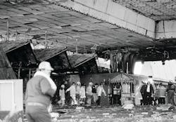 Firefighters remove the remains of one of the victims in the MGM Grand Hotel and Casino fire in Las Vegas, NV, on Nov. 21, 1980. Over 75 people died when a fire swept through the 26-story hotel and casino, causing hundreds of hotel guests to be trapped on the upper floors.