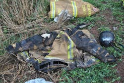 Firefighter Jed Gregory’s account of the incident says, “The heat became intense and within seconds the room that was previously showing only light smoke was fully involved in flames.” After leaving the structure unassisted, he was treated for first- and second-degree burns to both hands, forearms, left elbow and right shoulder. The photo shows his turnout coat and facepiece. Firefighter Jed Gregory’s account of the incident says, “The heat became intense and within seconds the room that was previously showing only light smoke was fully involved in flames.” After leaving the structure unassisted, he was treated for first- and second-degree burns to both hands, forearms, left elbow and right shoulder. The photo shows his turnout coat and facepiece.