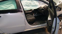 The four doors on the Chevrolet VOLT have conventional hinge and latch assemblies, a high-strength collision beam inside, and tempered-glass safety windows. Note how the deployed roof airbag obstructs patient access. The bag can be cut away by responders on scene.