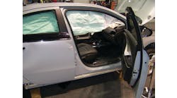 The four doors on the Chevrolet VOLT have conventional hinge and latch assemblies, a high-strength collision beam inside, and tempered-glass safety windows. Note how the deployed roof airbag obstructs patient access. The bag can be cut away by responders on scene.