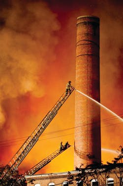 Firefighters battle a blaze at the former Union Wadding Mill early Thursday morning in Pawtucket, R.I.