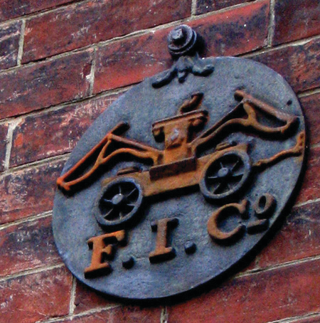 This fire mark, mounted on an exterior wall, was photographed in Alexandria, VA.