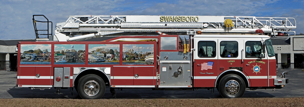 Swansboro Fire Department - with the help of Members and a local Business - found a way to create a customized look for their ladder struck. The truck recieved a panoramic mural of the Town of Swansboro looking at it across the White oak river