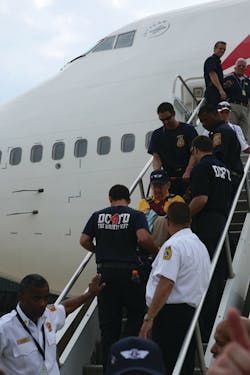 DCFD personnel assist the veterans upon their arrival in Washington, DC. They then boarded buses for the trip to the World War II Memorial. DCFD personnel assist the veterans upon their arrival in Washington, DC. They then boarded buses for the trip to the World War II Memorial.