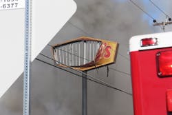 The fire burned-away the 30-foot sign at the road. The fire burned-away the 30-foot sign at the road.