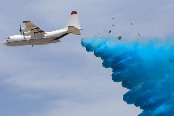 Photo 1. A C-130 with 16 PCADS being deployed in air-drop test at U.S. Army Yuma Proving Grounds.