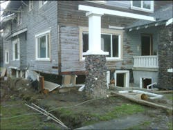 The house was blown off its foundation on one corner and several windows and doors were damaged. The house was blown off its foundation on one corner and several windows and doors were damaged.