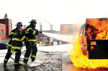 Bobby Parnell and Dillon Gee extinguish a car fire.
