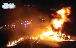 A fiery accident just west of downtown Dallas closed Interstate 30 for hours and left three people hurt. A fiery accident just west of downtown Dallas closed Interstate 30 for hours and left three people hurt.