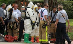 Hazmat team members get ready to investigate a fire at Oxygen Development LLC in Deerfield Beach. Hazmat team members get ready to investigate a fire at Oxygen Development LLC in Deerfield Beach.