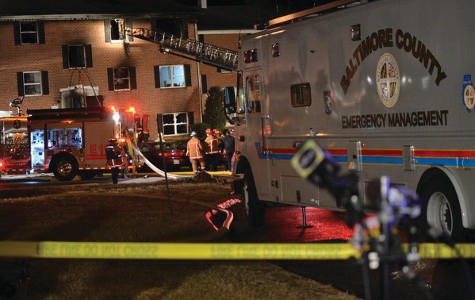 A Lutherville volunteer firefighter was killed and two residents were injured in a four-alarm blaze that engulfed an apartment building.