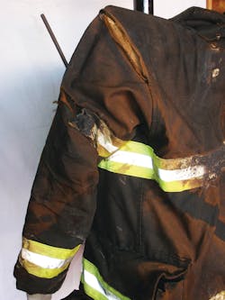 The firefighter&rsquo;s bunker gear was found to be subjected to heat in excess of 1,000 degrees Fahrenheit. Visible are burns to his bunker coat and the location where the seam popped on the coat.