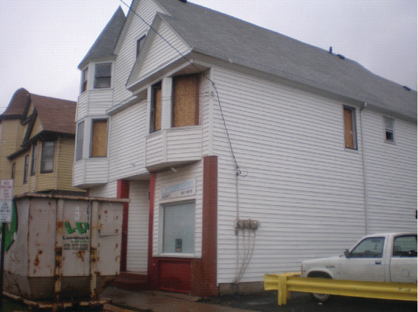 Photo 1. Upon arrival at the Lansing Avenue fire, Cleveland, OH, firefighters saw only very light smoke showing, but recognized the odor of a structural fire. Note there is no smoke discoloring around these windows, even after the fire. The upstairs suite was gutted from a heavy fire condition. There was a reported person trapped, but a search was negative.