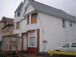Photo 1. Upon arrival at the Lansing Avenue fire, Cleveland, OH, firefighters saw only very light smoke showing, but recognized the odor of a structural fire. Note there is no smoke discoloring around these windows, even after the fire. The upstairs suite was gutted from a heavy fire condition. There was a reported person trapped, but a search was negative. Photo 1. Upon arrival at the Lansing Avenue fire, Cleveland, OH, firefighters saw only very light smoke showing, but recognized the odor of a structural fire. Note there is no smoke discoloring around these windows, even after the fire. The upstairs suite was gutted from a heavy fire condition. There was a reported person trapped, but a search was negative.