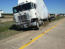 This truck is contacting the cable system, however the degree of contact still allows full access to the cab through either door. The degree of obstruction presented by the cables must focus on whether any doors are blocked and whether side windows, the windshield, or the roof area of the vehicle are directly contacted by the high-tension cables. This truck is contacting the cable system, however the degree of contact still allows full access to the cab through either door. The degree of obstruction presented by the cables must focus on whether any doors are blocked and whether side windows, the windshield, or the roof area of the vehicle are directly contacted by the high-tension cables.