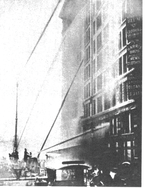 Water towers and deck pipes drive large- caliber streams into the blazing Asch Building, home of the Triangle Shirtwaist Co. In all, 146 workers, mostly young women, died as a result of the fire.