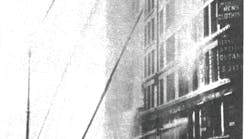 Water towers and deck pipes drive large- caliber streams into the blazing Asch Building, home of the Triangle Shirtwaist Co. In all, 146 workers, mostly young women, died as a result of the fire.