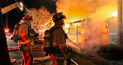 Gwinnett County firefighters Thursday battle a predawn blaze at the Spalding Hills apartment complex off Winters Chapel Road near Norcross, Ga.