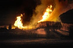 A fire burns at Hanover Farms in Hanoverton, Ohio after what officials believe was a natural gas pipeline explosion.
