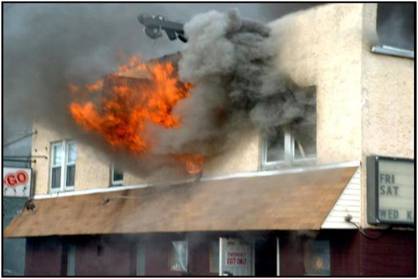 Photo 1. Taxpayers can have mixed occupancies in the same building. This working fire was in the residential section of the structure.