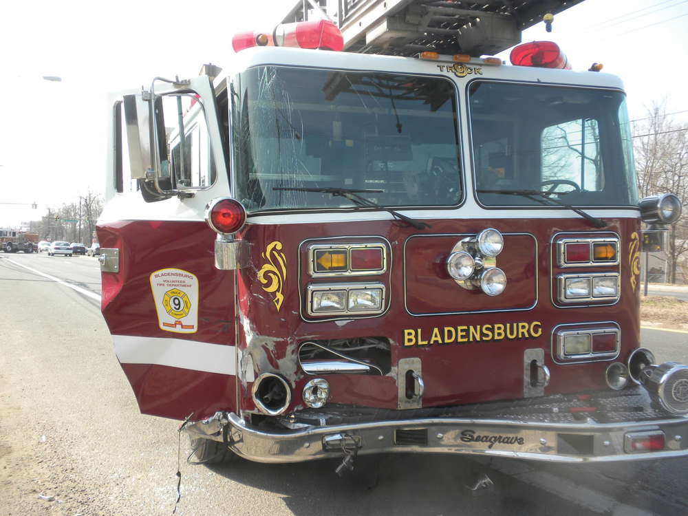 Truck 809 was responding with emergency lights and siren sounding when it collided with a Jeep Liberty at Kenilworth Avenue and Decatur Street in Bladensburg.
