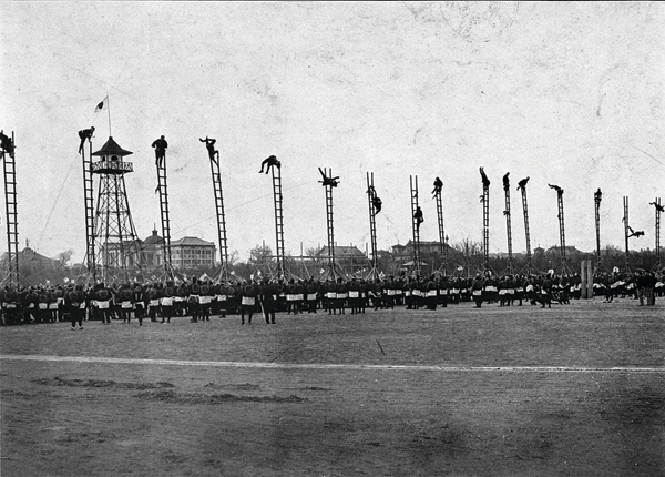 Firefighters in Tokyo, Japan, demonstrate their ladder-climbing skills in this 1911 photo.