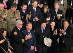 Australian Firefighter Rob Frey, third from front left, and FDNY Firefighter James Dowdell, holding helmet, are recognized in a speech by Australian Prime Minister Julia Gillard.