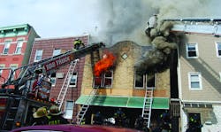 BROOKLYN, NY, FEB. 7, 2011 &ndash; A fire in a two-story brick commercial building spread to exposure two. Four handlines and one tower ladder were used to knock down the heavy fire.