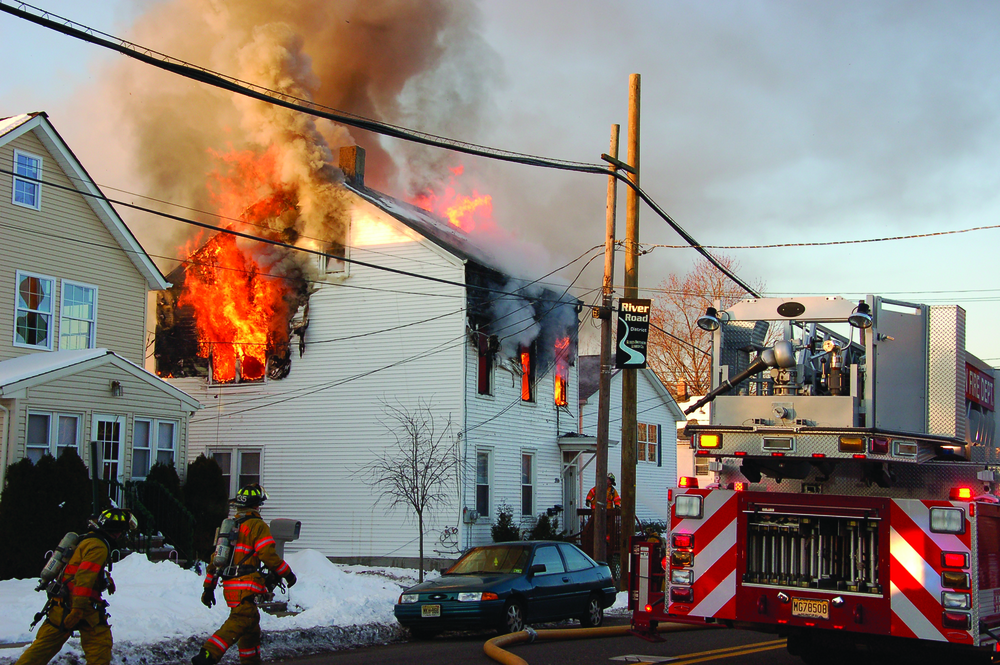 FAIR LAWN, NJ, FEB. 24, 2011 &ndash; A two-family home was destroyed in a two-alarm blaze, leaving four people homeless, including one person in a wheelchair. Units were dispatched shortly before 7 A.M. First-arriving police units confirmed that heavy smoke and fire was visible. All residents safely evacuated the building before the arrival of fire units, but flames had full possession of the second floor and attic. A second alarm was transmitted as exposure lines were put in operation. An interior attack was attempted, but heavy fire and the possibility of collapse made that untenable. Several exterior lines were put into operation as well as an elevated master stream in the rear. After about a one-hour battle, the flames were darkened down and held to the original fire building. The heat had melted the siding on both exposure buildings, but no other damage was reported. The cause is under investigation.
