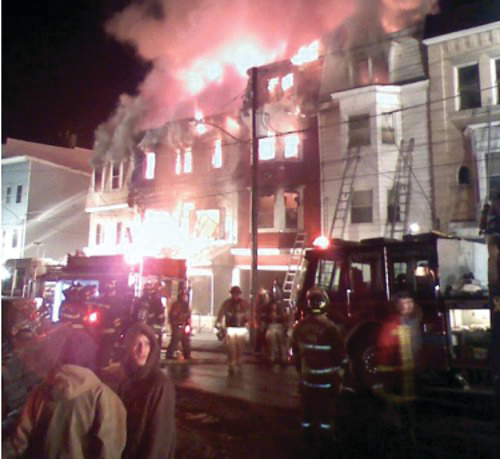 A firefighter had to be rescued from a window and two others were escorted out by a RIT team during a Girardville a blaze that destroyed five row homes on Feb. 23.